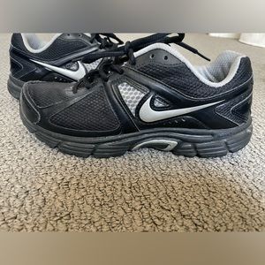 Nike size 7.5 black and silver sneakers.